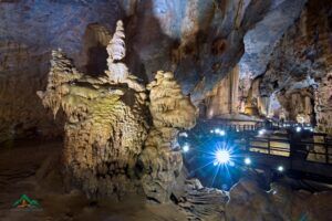 A cave with lights in the ceiling Description automatically generated with medium confidence